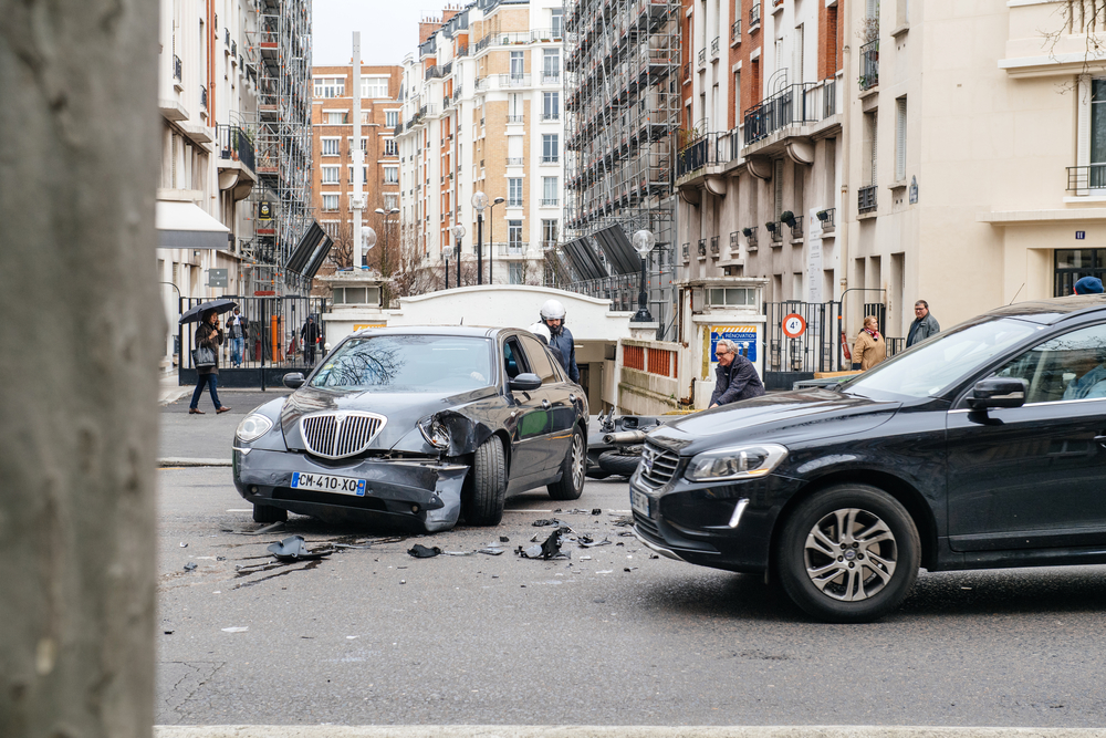 Car accident on Paris street between luxury limousine Lancia Th